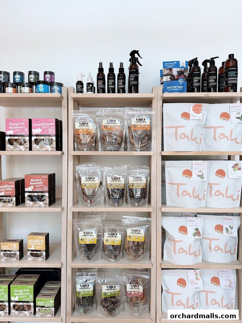Shelves stocked with various pet treats, grooming products, and accessories.