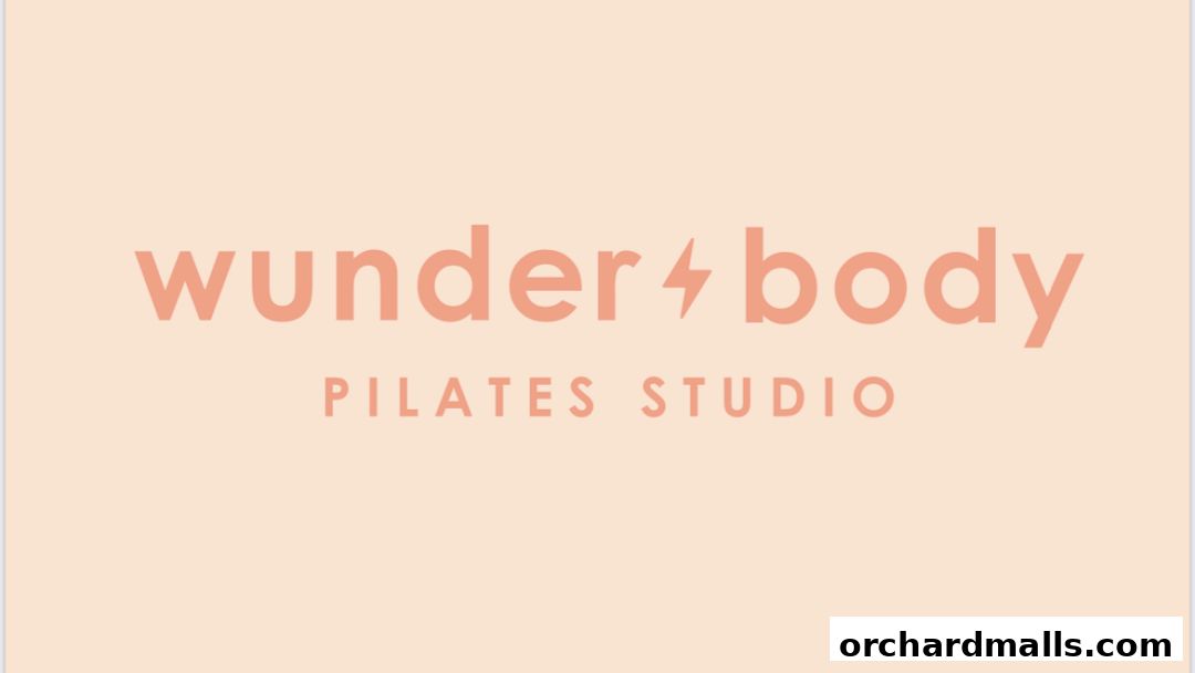 The logo for Wunderbody Pilates Studio with a peach background.