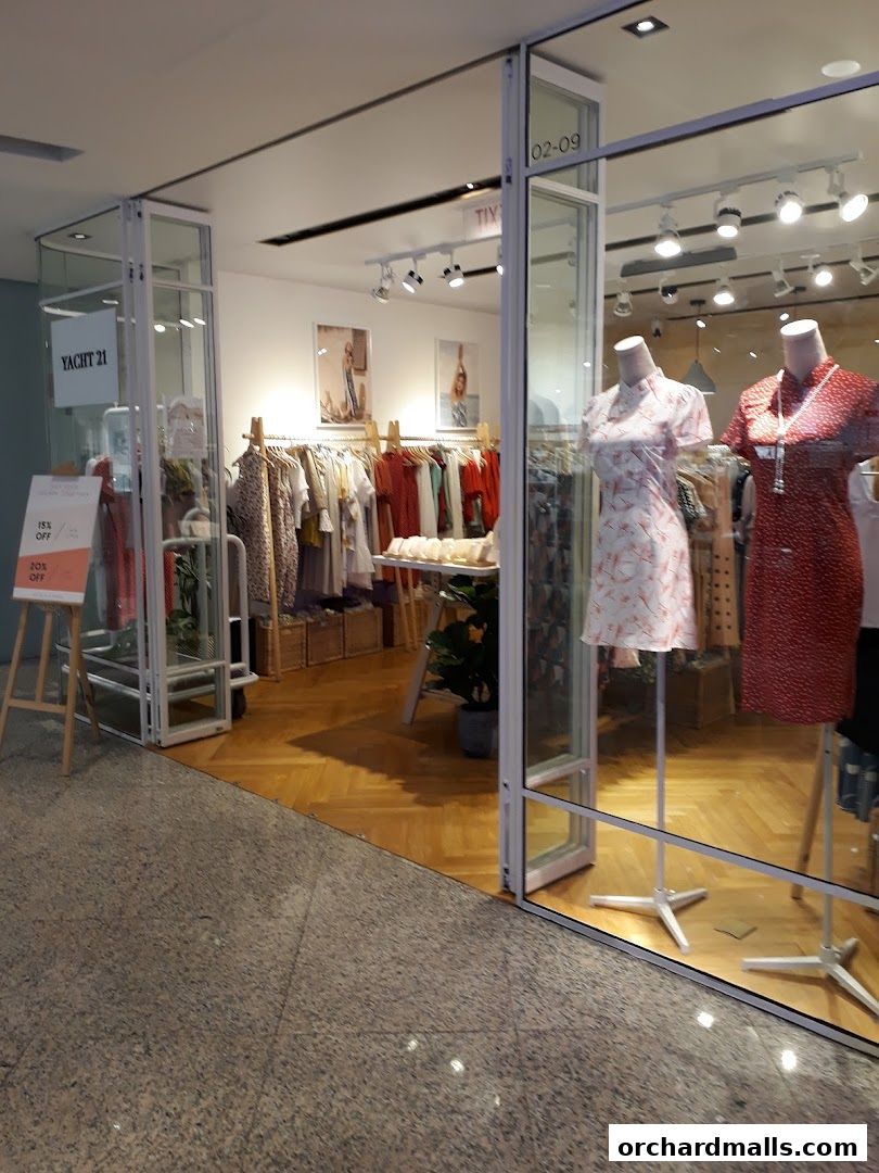 Yacht 21 Wheelock Store entrance with mannequins and clothing displays.