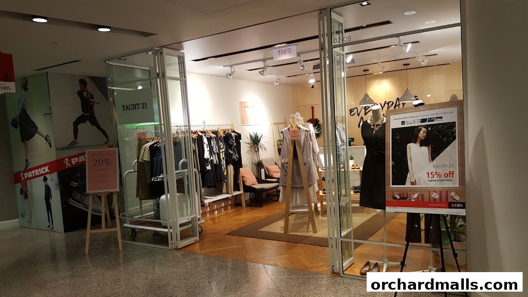 Yacht 21 store entrance with clothing displays and promotional posters.