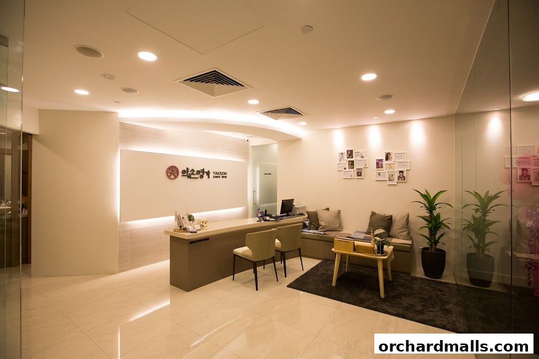Interior of a clean and modern reception area with a reception desk and seating.