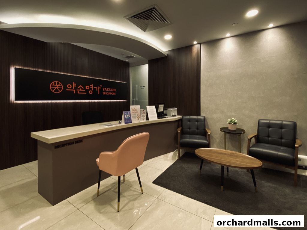 Reception area of Yakson Singapore with a reception desk and seating.