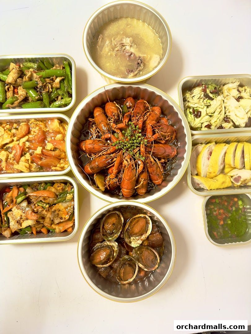 A spread of delicious Chinese dishes including crawfish, abalone, soup, and stir-fries.