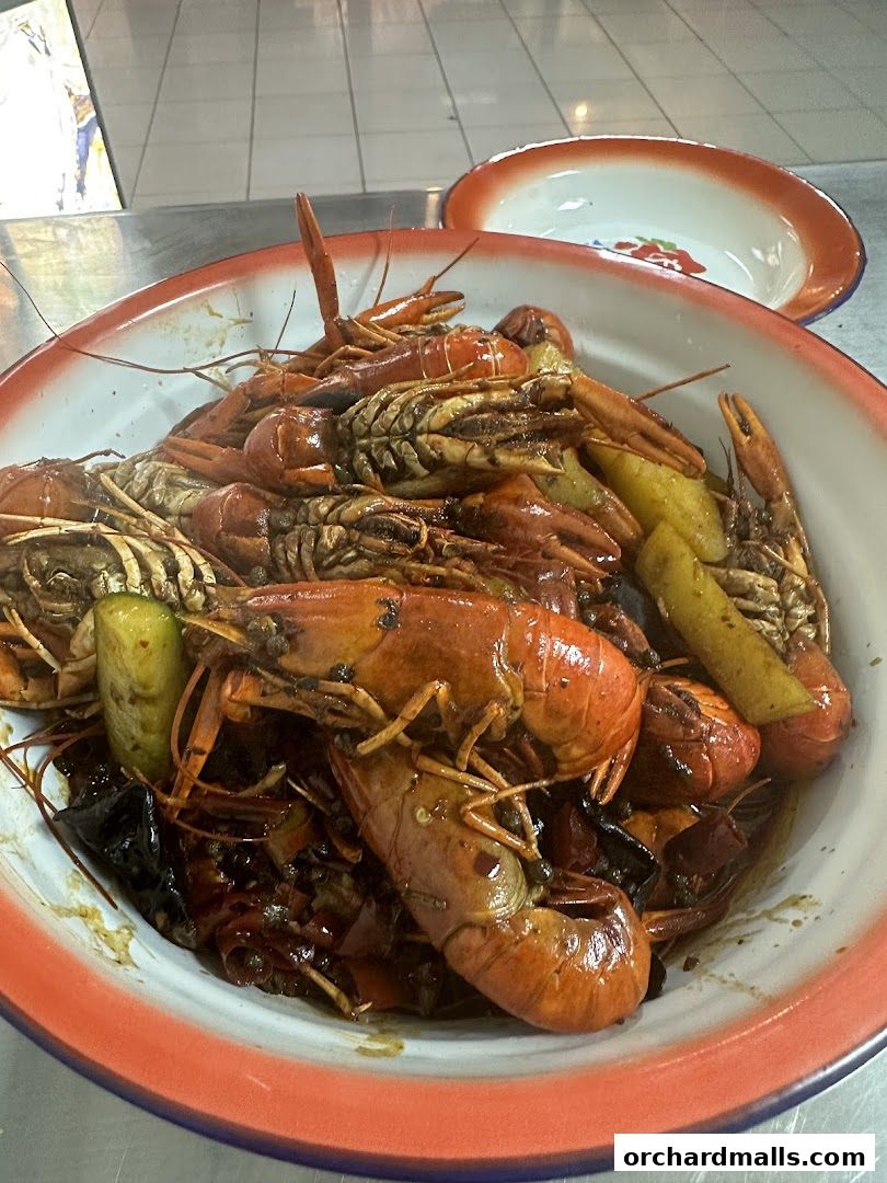 A large bowl filled with delicious crawfish and other ingredients, ready to be served.
