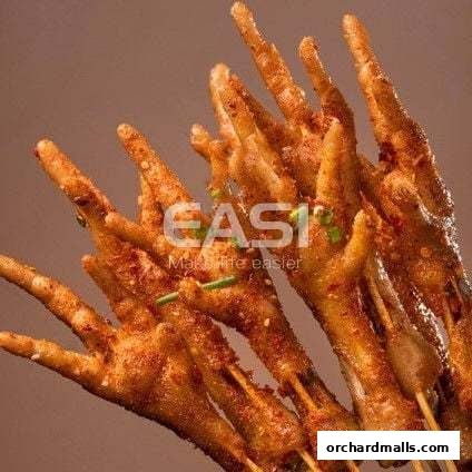 Close-up of delicious, spicy grilled chicken feet skewers.