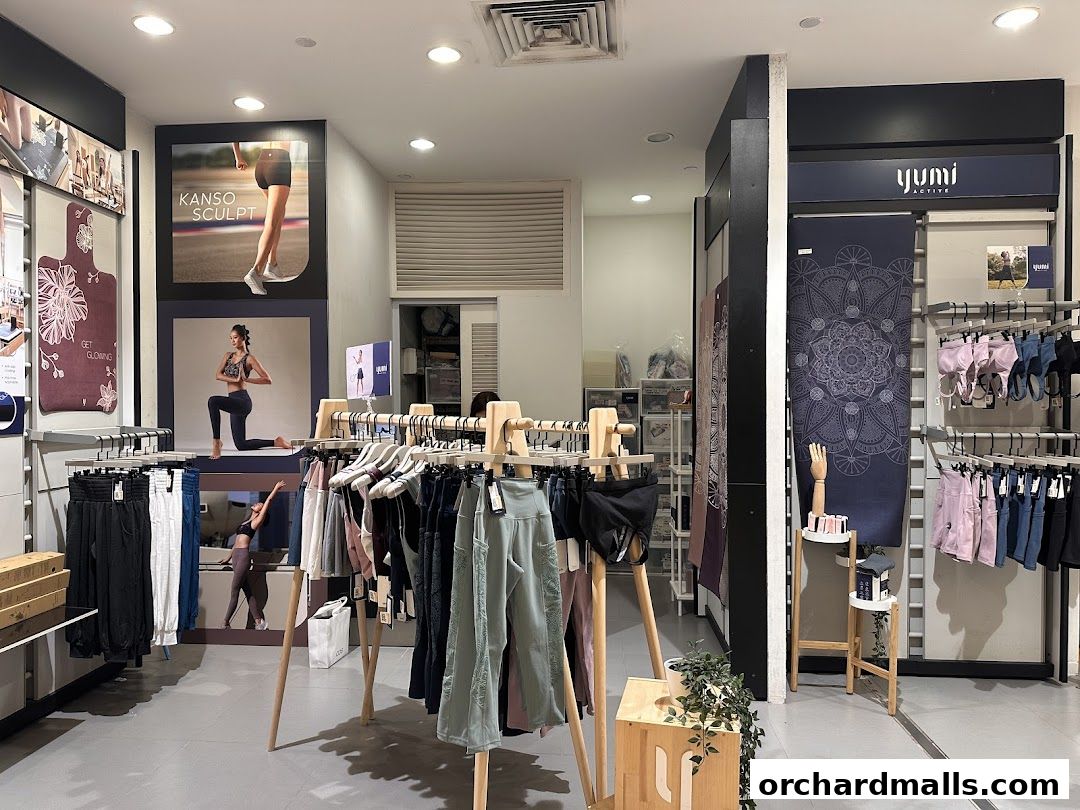 Interior view of Yumi Active store showcasing activewear and yoga mats.