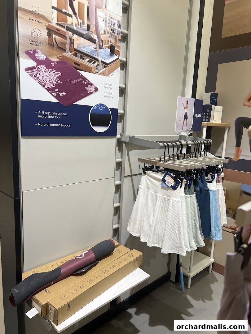 Yumi Active shop interior displaying yoga mats and athletic skirts.