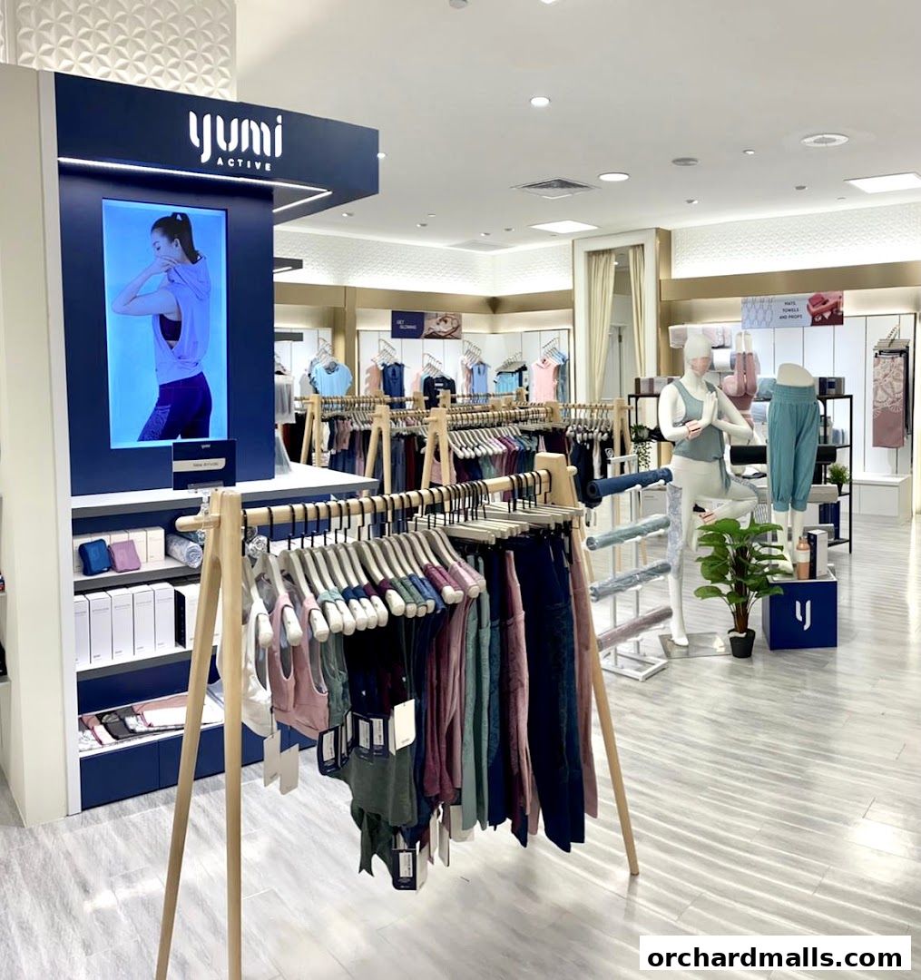 Interior view of Yumi Active store showcasing activewear on racks and mannequins.