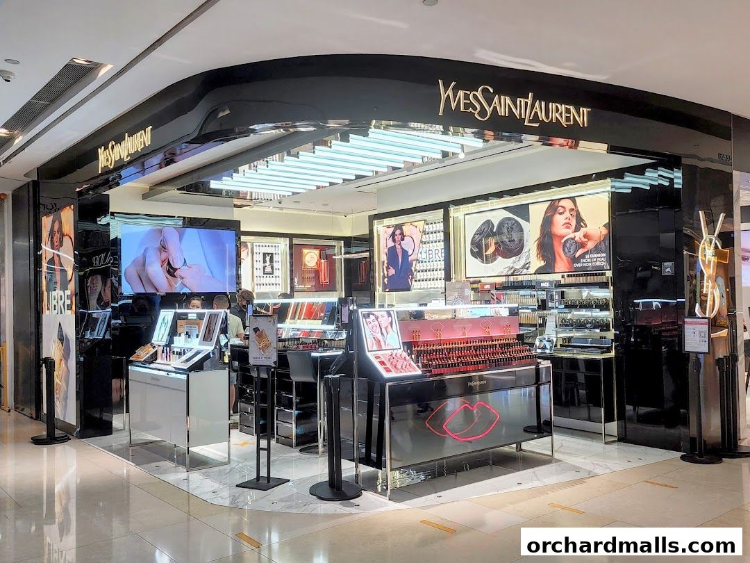 The Yves Saint Laurent Beaute shop front displays makeup products and promotional imagery.