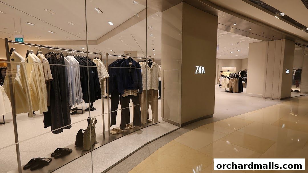 Zara store interior with clothing displays and the Zara logo visible.