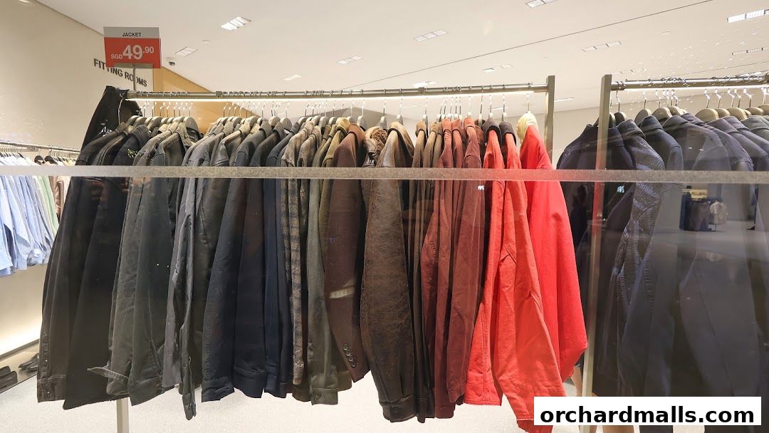A rack of jackets in various colors, with a price tag for a jacket.