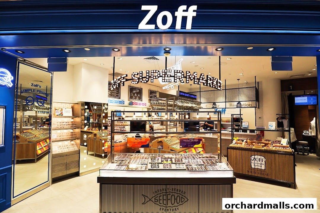 The Zoff eyewear store features a bright, modern interior with a wide selection of glasses on display.
