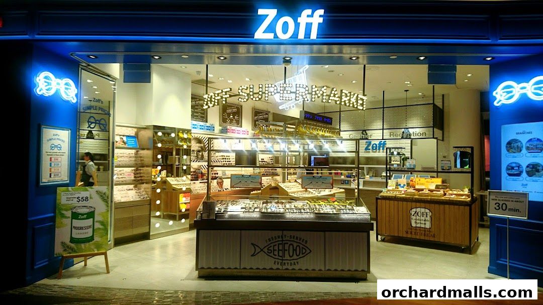 The Zoff ION Orchard shop front displays a wide selection of eyeglasses and promotional signage.